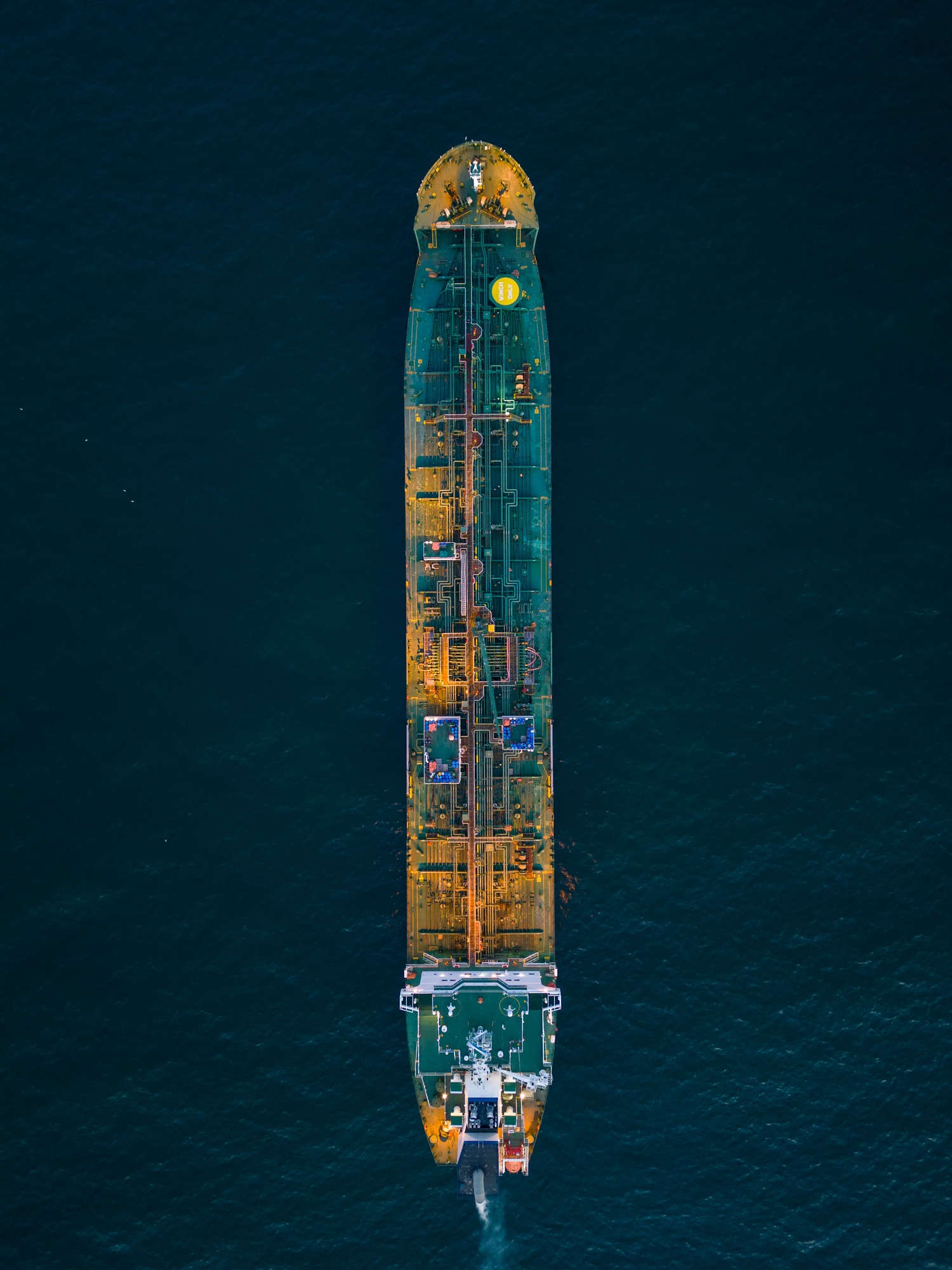Aerial view oil ship tanker carrier oil on the sea at sunset
