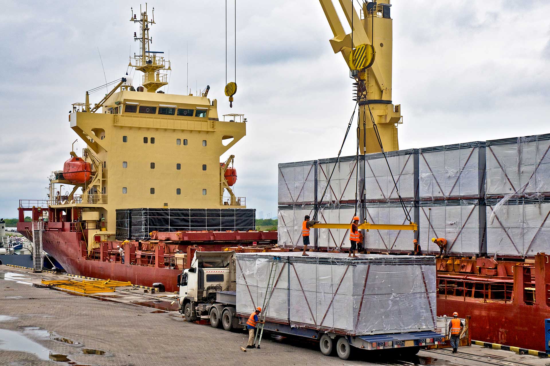 loading-cargo-into-the-ship-in-harbor-2023-11-27-04-56-46-utc.jpg