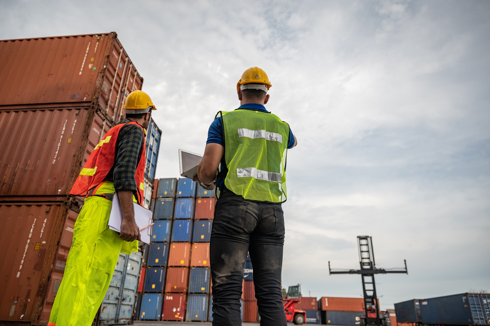 port employee checks containers in the container terminal